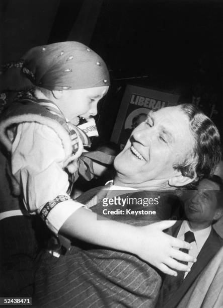 Liberal National Country Party leader Malcolm Fraser lifting up a young supporter at a rally in Sydney two days before the Australian general...