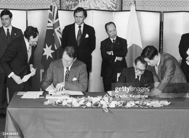 Asutralian Prime Minister Malcolm Fraser and his Japanese counterpart Takeo Miki signing a friendship treaty at the latter's official residence in...