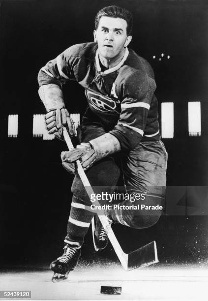 Canadian professional hockey player Maurice 'Rocket' Richard of the Montreal Canadiens skates toward the camera with the puck, late 1940s.