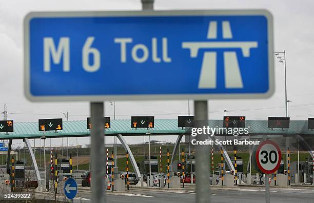 Vehicles aproach the M6 motorway toll booths on March 13, 2005 in Birmingham, England. The number of vehicles using the Toll road which opened in...