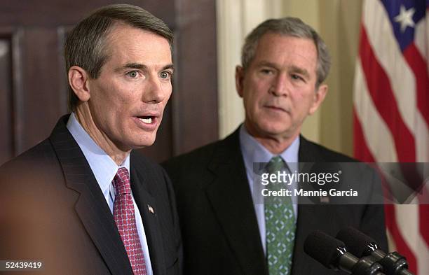 Representative Rob Portman makes remarks as U.S. President George W. Bush stands nearby in the Roosevelt Room of the White House March 17, 2005 in...