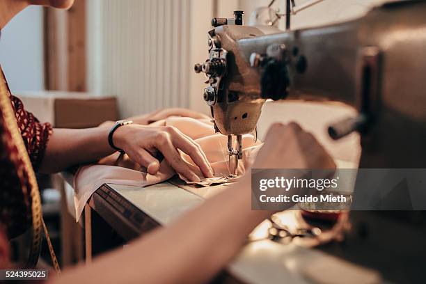 tailor working with sewing machine. - macchina per cucire foto e immagini stock