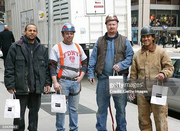 Four unidentified men pose with their IN:NYC St. Patrick's Day Survival Kit on March 17, 2005 in New York City. American Express IN:NYC Credit Card...
