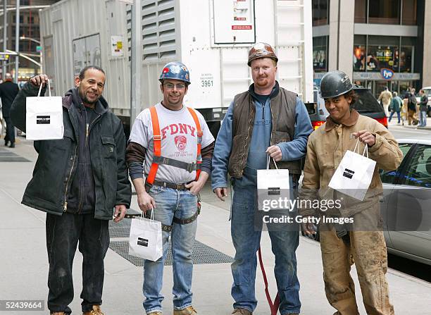 Four unidentified men pose with their IN:NYC St. Patrick's Day Survival Kit on March 17, 2005 in New York City. American Express IN:NYC Credit Card...