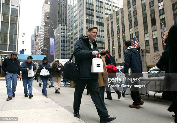 Unidentified man walks away with an IN:NYC St. Patrick's Day Survival Kit on March 17, 2005 in New York City. American Express IN:NYC Credit Card...