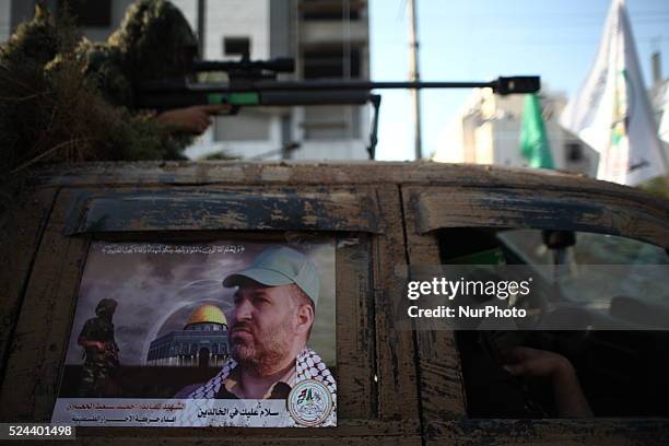 Picture of the late Hamas military commander Ahmed Al-Jaabari stuck on a military truck during a parade for militants of the Ezzedine al-Qassam...