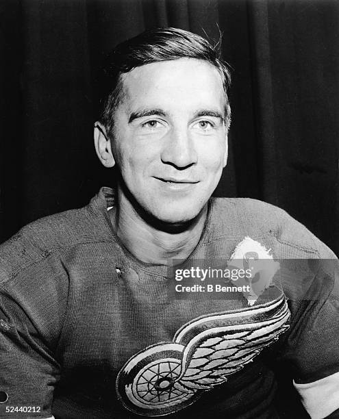 Portrait of Canadian hockey player Ted Lindsay of the Detroit Red Wings in a torn jersey, 1950s.