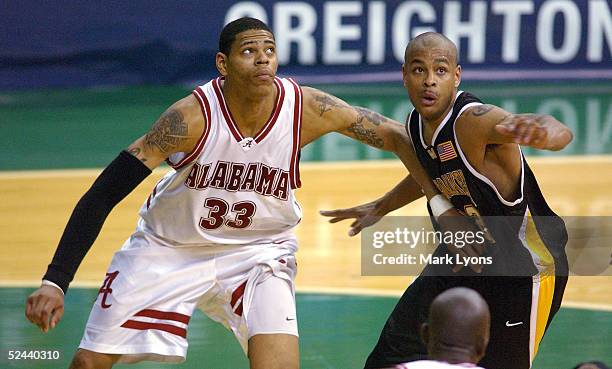 Jermareo Davidson of the Alabama Crimson Tide battles Ed McCants of the Milwaukee-Wisconsin Panthers during the first round of the 2005 NCAA...