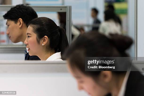 Jobseekers speak with recruitment representatives at a job fair in Goyang, South Korea, on Tuesday, April 26, 2016. South Korea's economy slowed in...