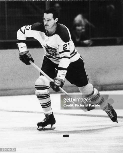 Canadian hockey player Frank Mahovlich of the Toronto Maple Leafs skates up the ice with the puck, March 21, 1965.