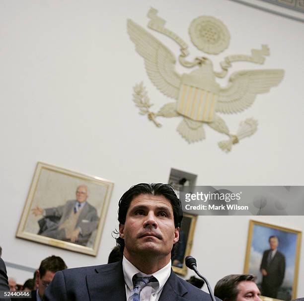 Former Major League Baseball player Jose Canseco listens during a House Committe session investigating Major League Baseball's effort to eradicate...