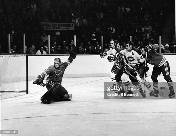 Canadian professional hockey player Glenn Hall, goalie of the St. Louis Blues, makes a save in a game against the Montreal Canadiens, Montreal,...