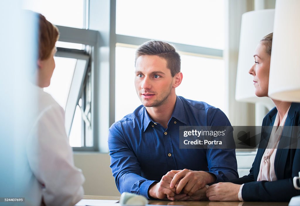 Couple consulting doctor