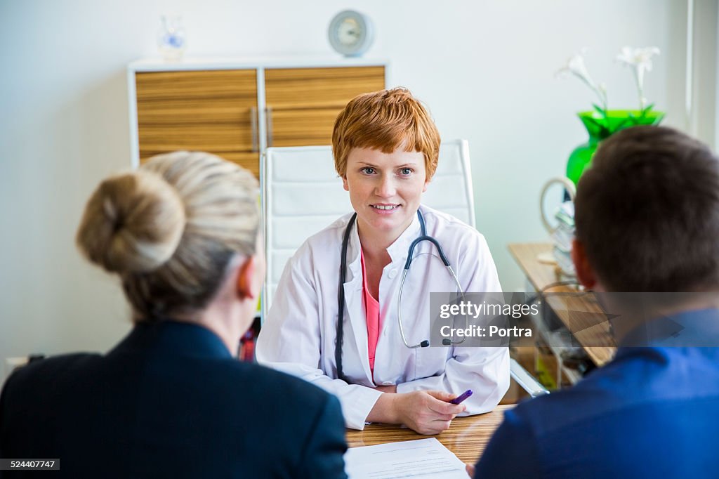 Doctor advising couple