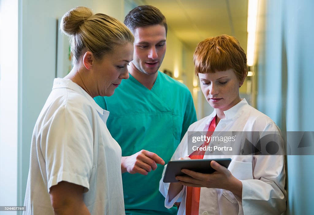Medical team using digital tablet