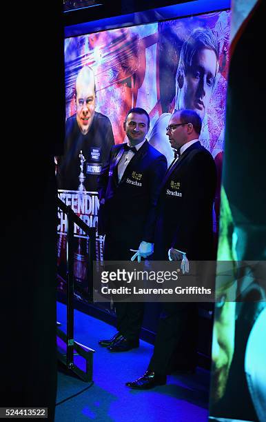 Referees Terry Camilleri and Colin Humphries prepare to walk out for their quarter final matches on day eleven of the World Championship Snooker at...
