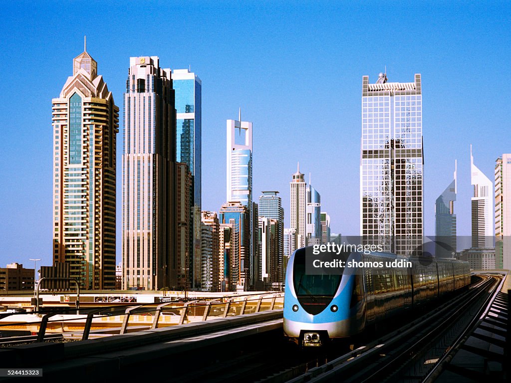 Dubai Metro with city skyline behind