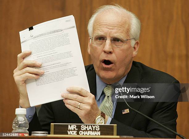 Rep. Christopher Shays holds up a draft of Major League Baseball's steroid policy during a congressional hearing investigating steriod use in...