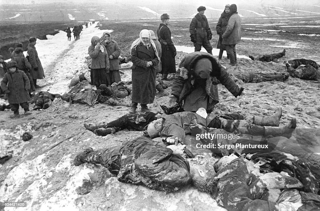 Woman Grieves Over Husband's Body