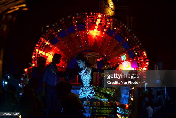 An Indian artist dressed as the Hindu Lord Shiva takes part in a 'Ravan ki Barat' procession held to mark the forthcoming Dussehra festival in...