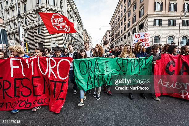 Students shout slogans, wave flags and hold banners during a national demonstration to protest against Italian Prime Minister Matteo Renzi's 'the...