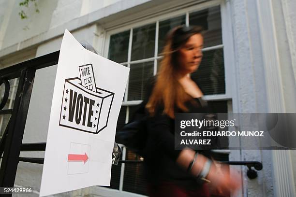 Woman arrives at a polling station to cast her ballot during Pennsylvania State primary presidential election on April 26, 2016 in Philadelphia,...