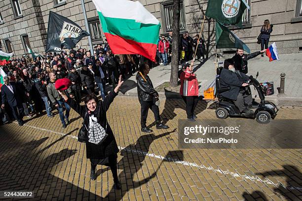 Woman runs to greet Ataka Party leader Volen Siderov during a march through Sofia on in Sofia, the capital, on March 3 which is Liberation Day, a...