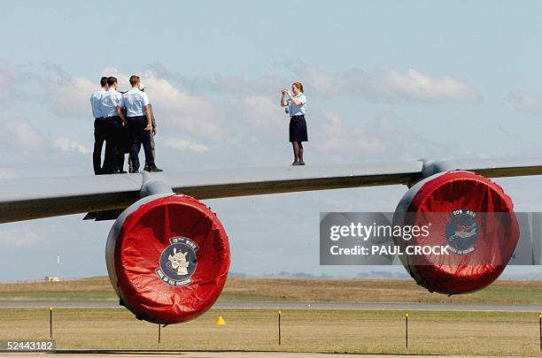 Royal Australian Air Force Cadets take a picture on the wing of a US Air Force KC 135 R aerial refuelling tanker during the first public day of the...