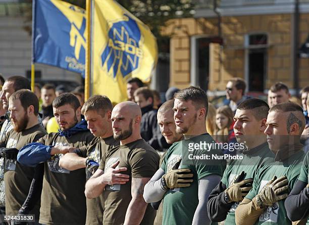 Ukrainian fighters sing the national anthem of Ukraine,before a tournament &quot;Strong Nation&quot; organized by volunteers battalion Azov at St....