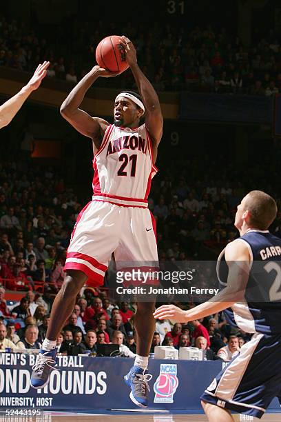 Hassan Adams of the Arizona Wildcats puts up a shot against the Utah State Aggies during the 2005 NCAA division 1 men's basketball championship...