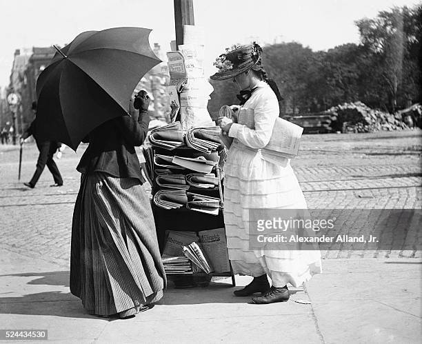 Women selling newspapers at 23rd Street and 5th Avenue, New York City.