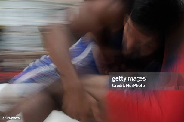 Men, boys and the spectators during an amateur wrestling competition on 24th October at Burrabazar- a congested, busy and ancient market place in...