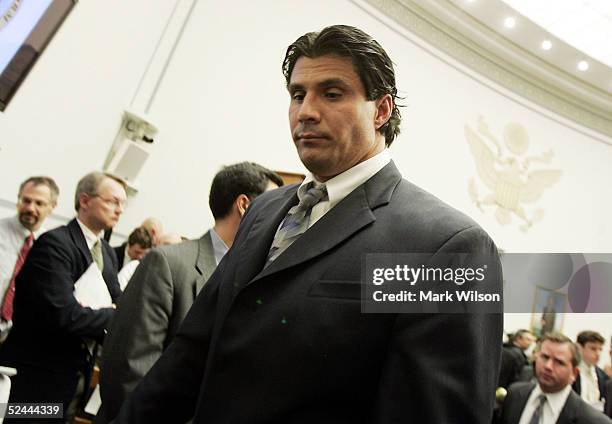 Former Oakland Athletic and Texas Ranger Jose Canseco departs the committee room at the end of testimony March 17, 2005 to a House Committee session...