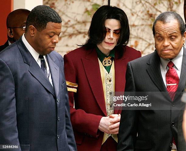 Michael Jackson and his father Joe Jackson leave the court house after police removed and questioned a man from the fan gallery at the Santa Maria...