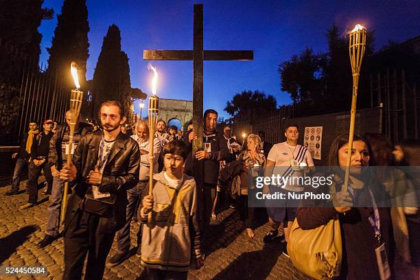 Thousands of Gypsies attend celebrations of the Via Crucis outside the Colosseum in Rome on October 24, 2015. Thousands of Gypsies have come from all...