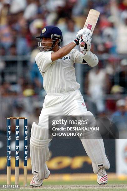 Indian cricketer Sachin Tendulkar eyes the ball during the third day of the second Test match between India and Pakistan at the Eden Gardens Stadium...