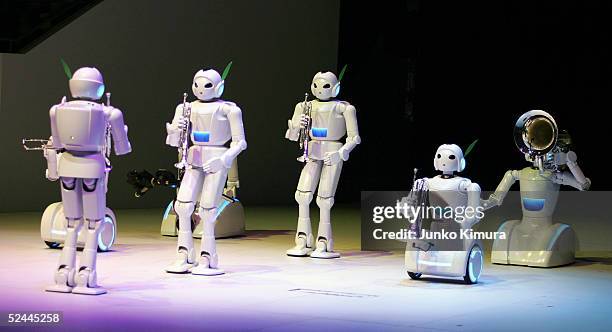 Toyota's music playing robots play trumpets, tuba and trombone, during the press day of the Aichi World Exposition 2005 on March 18, 2005 in...