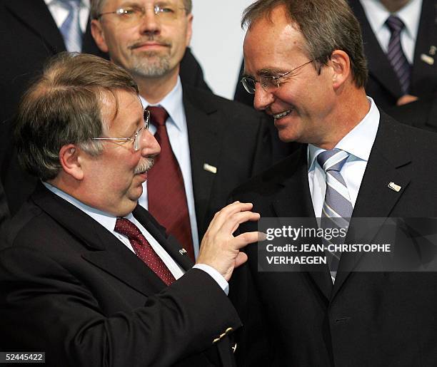 Dutch defence minister Henk Kamp chats with his Belgian counterpart Andre Flahaut prior to a family picture during a ministerial meeting , 18 March...