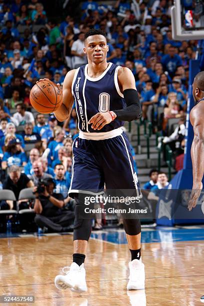 Russell Westbrook of the Oklahoma City Thunder dribbles the ball in Game Three of the Western Conference Quarterfinals against the Dallas Mavericks...