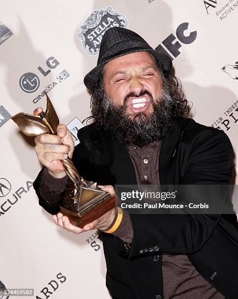 Thierry "Mr. Brainwash" Guetta poses with the award won by the artist Bansky for Best Documentary in the press room at the 26th Annual Film...