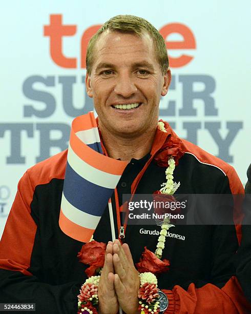 Liverpool coach Brendan Rodgers poses with Thailand flag as he arrives at Suvarnabhumi airport in Samut Prakan, Thailand on July 13, 2015. Liverpool...