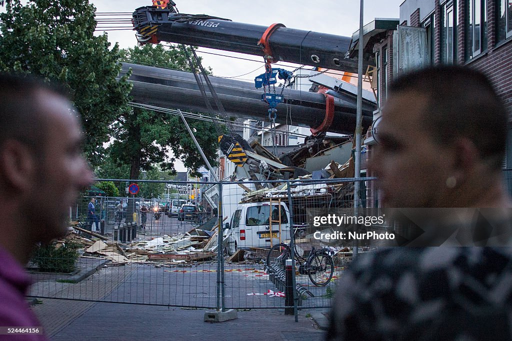 Heavy cranes destroy houses in Netherlands