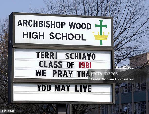 Sign at Archbishop Wood High School, where Terri Schiavo graduated in 1981, shows support for her and her family March 18, 2005 in Warminster,...