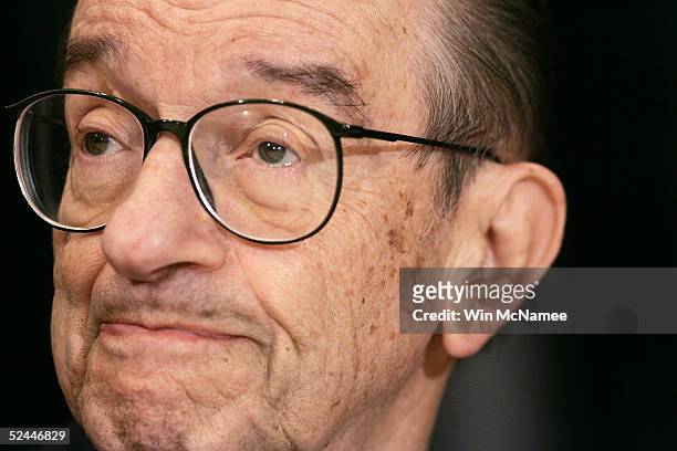 Federal Reserve Chairman Alan Greenspan listens as he is introduced for a speech to the National Community Reinvestment Coalition March 18, 2005 in...