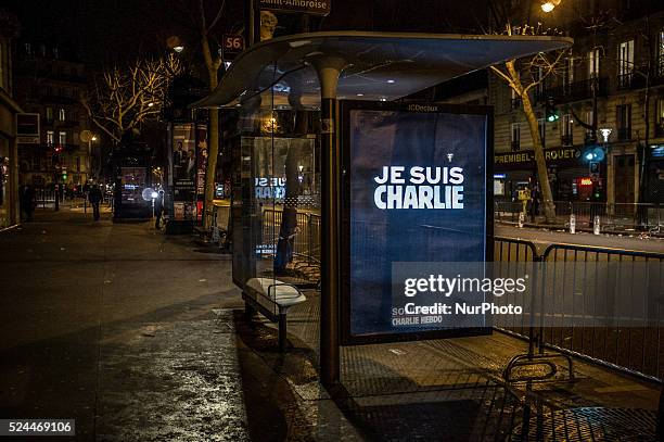 People gather to light candles and write on the Place De La Republic, during a Unity rally &quot;Marche Republicaine&quot; on January 11, 2015 in...