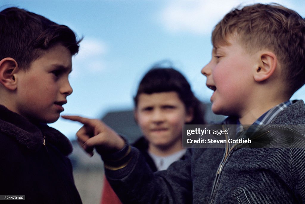 Boy Ridiculing Another