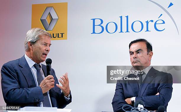 The CEO of French carmaker Renault, Carlos Ghosn, and French industrial group Bollore head Vincent Bollore give a press conference at the Atelier...