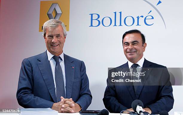 The CEO of French carmaker Renault, Carlos Ghosn, and French industrial group Bollore head Vincent Bollore give a press conference at the Atelier...