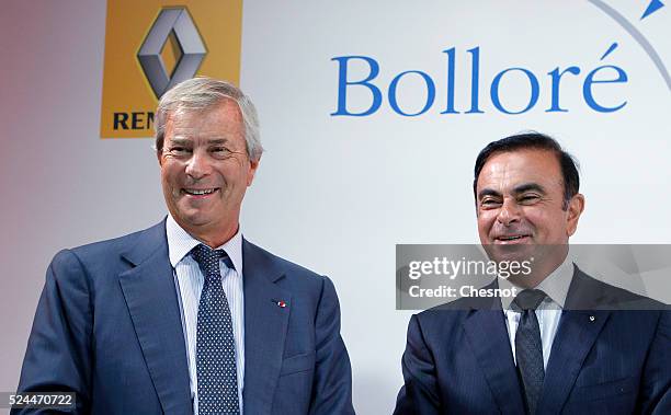 The CEO of French carmaker Renault, Carlos Ghosn, and French industrial group Bollore head Vincent Bollore give a press conference at the Atelier...