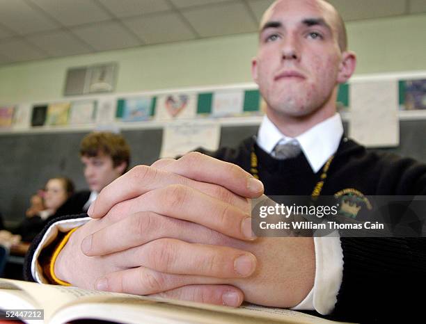 Bill Salamone, a student at Archbishop Wood High School, where Terri Schiavo graduated in 1981, pray that she may live March 18, 2005 in Warminster,...